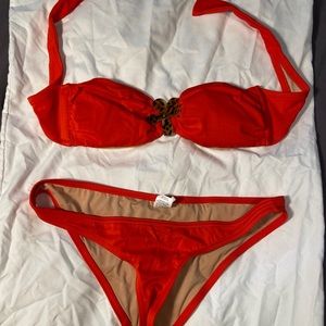 Red J. Crew bikini with flower pendant
